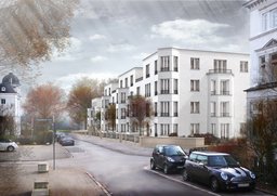 Straßenperspektive der hell verputzten Mehrfamilienhäuser mit Erkern und Vorgartenzone