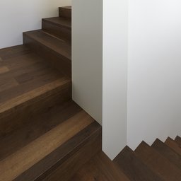 Minimalistische Holztreppe mit dunklen Massivholzstufen an weißer Wandscheibe